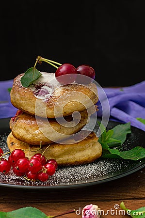 Pancakes with cherries. Wooden background. Close-up. Top view Stock Photo