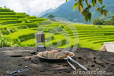 Pancakes and coffee with rice paddy view on the background Stock Photo