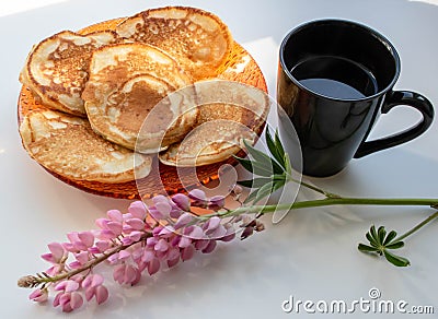 Pancakes and a cup of black coffee lupin Stock Photo