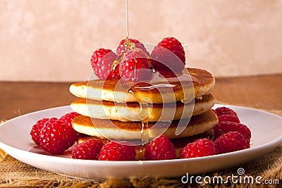 Pancakes with fresh and delicious raspberries. Stock Photo