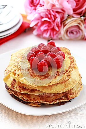 Pancakes with fresh raspberries Stock Photo