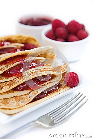 Pancakes with raspberry jam & fresh raspberries Stock Photo