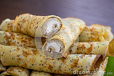 Pancakes rolls with cottage cheese. Pancakes with cheese. Shrovetide. Stock Photo