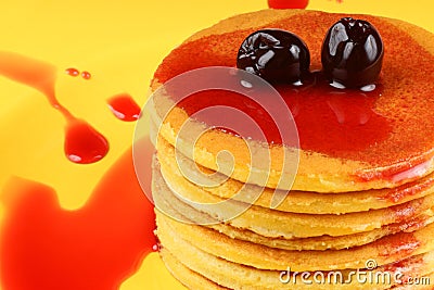 Pancakes with syrup and sour cherries Stock Photo