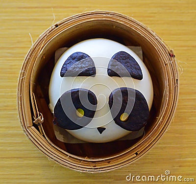 Panda Chinese bun in a Dimsum Bamboo Basket Stock Photo