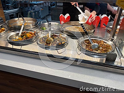 Panda Express chinese fast food restaurant employees waiting on customers Editorial Stock Photo