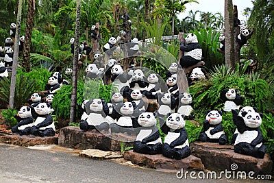 Panda statue in palm garden Stock Photo