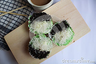 Pandan steamed sponge cake topped with cheese and chocolate sprinkles with a sweet taste and soft texture. Stock Photo