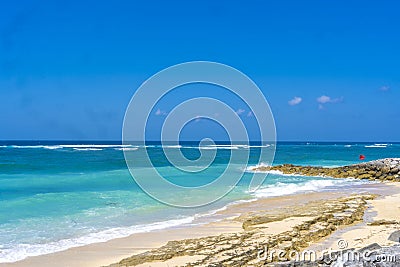 White sand, turquoise waters against the blue sky at Pandawa Beach, Bali, Indonesia. Stock Photo