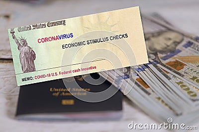 Pandemic Covid 19 lockdown Coronavirus stimulus package relief checks from government US 100 dollar bills currency Stock Photo