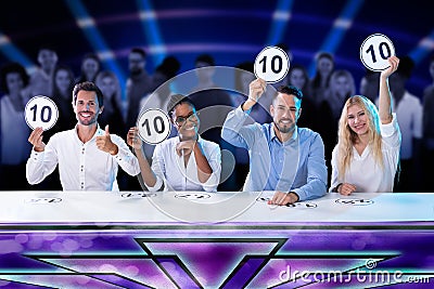 Panel Judges Holding 10 Score Signs Stock Photo