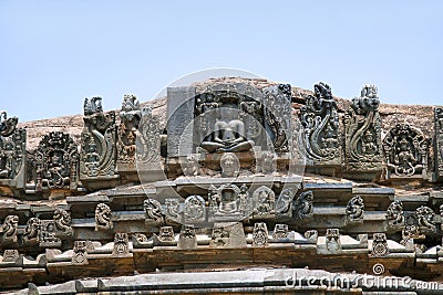 A panel sulpture showing the Jain tirthankara with Yaksha on both the side, Parshvanatha Basadi, Basadi Halli jain temple complex, Stock Photo