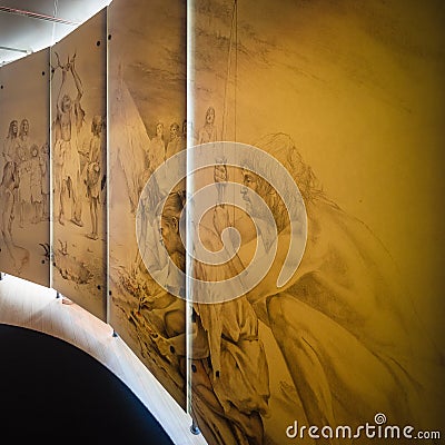 Panels representing the history of human evolution in the science museum of Trento, Italy Editorial Stock Photo