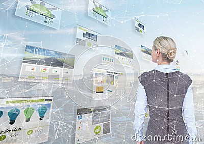 panels with websites (green). city background and stars in front. Blond business woman looking it Stock Photo