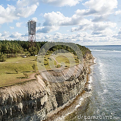 Panga coastal cliff and lighthouse Panga pank, Saaremaa island, near Kuressaare, Estonia. North-Estonian limestone escarpment, Stock Photo