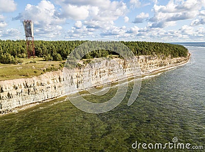 Panga coastal cliff and lighthouse Panga pank, Saaremaa island, near Kuressaare, Estonia. North-Estonian limestone escarpment, Stock Photo