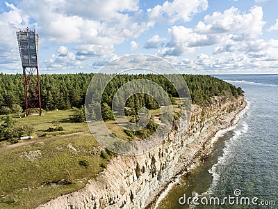 Panga coastal cliff and lighthouse Panga pank, Saaremaa island, near Kuressaare, Estonia. North-Estonian limestone escarpment, Stock Photo