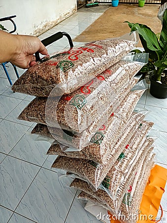 Pile of Red Rice Products packaged in plastic to be sold to the market Editorial Stock Photo