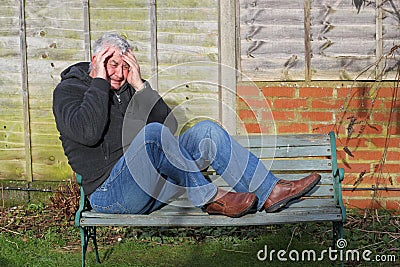 Panic attack man on a bench. Stock Photo