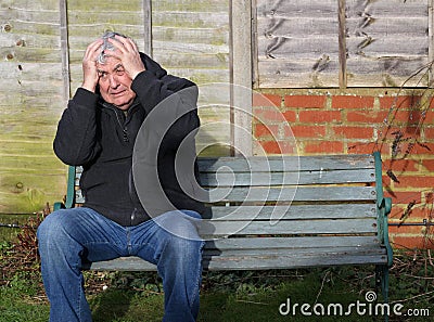 Panic attack man on a bench. Stock Photo