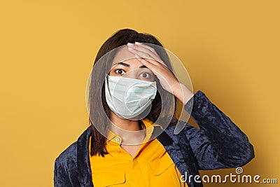 Panicking sick black woman on yellow. Epidemic and virus protection concept Stock Photo