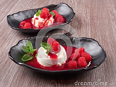 Panna cotta with raspberry coulis Stock Photo