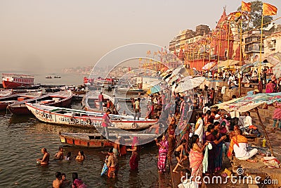 Varanasi Ghats early morning life pujas and bathing in the holy ganges Editorial Stock Photo