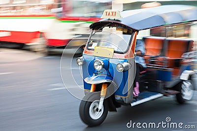 Panning of man riding tuk-tuk Stock Photo