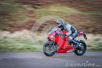 Panning Motorbike at Speed Stock Photo