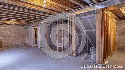 Pano House under construction with wood beams and air conditioning ducts on ceiling Stock Photo