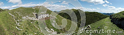 Panorama with abandoned barracks below of summit of Slatnik in Julian Alps in Slovenia Stock Photo