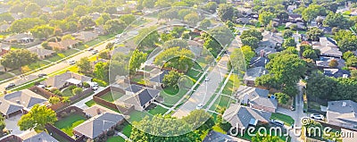 Panorama aerial view urban sprawl subdivision near Dallas, Texas, USA row of single family homes large fenced backyard Stock Photo