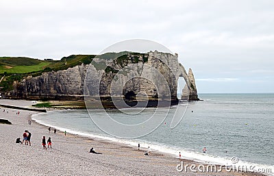 Panorama of a beautiful empty beach and white chalk cliffs and natural arches of Etretat city, Normandy, France Editorial Stock Photo