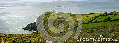 Panorama of beautiful scenery of Howth Head with Baily Lighthouse and green fields, county Dublin, Ireland Stock Photo