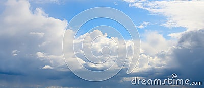 Panorama of the blue sky with cumulus dense clouds Stock Photo