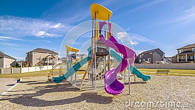 Panorama Brightly colored purple and blue slides during day Stock Photo