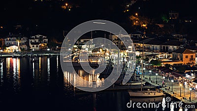 Panorama of the center of the night town of Sivota in the Greece. Editorial Stock Photo