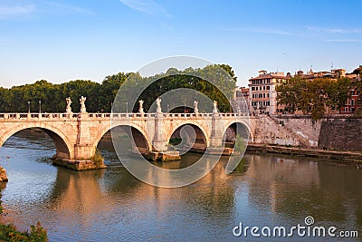 Panorama cityscape from the ancient embankment Tiber in Roma at sunset. Near of bridge and castle of Angels. Saint Angelo castle Stock Photo