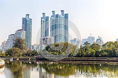 Panorama of cityscape with skyscrapers and skyline from Benjakitti Park in Bangkok, Thailand. Editorial Stock Photo