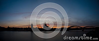 Panorama of Cologne skyline silhouette at sunrise Stock Photo