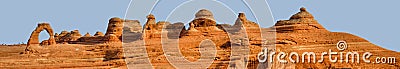 Panorama of Delicate Arch and tourists Stock Photo