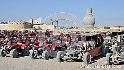 ATVs of tourists in the village of local residents of the Arabian desert, Egypt. Editorial Stock Photo