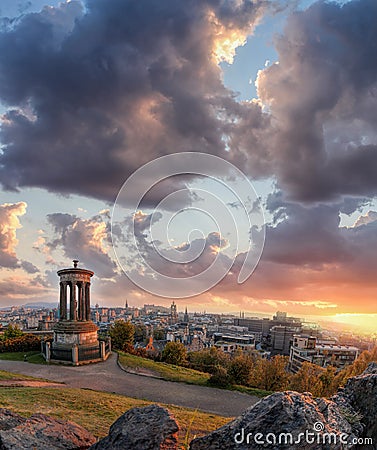 Panorama of Edinburgh against sunset with Calton Hill and castle in Scotland Stock Photo