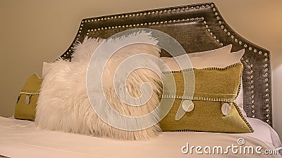 Panorama frame Bedroom interior with pillows against upholstered belgrave headboard of a bed Stock Photo