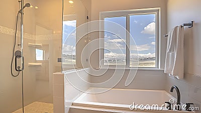 Panorama frame Built in square bathtub inside a bathroom with white wall and sliding window Stock Photo