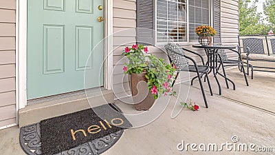 Panorama frame Front door of suburban home with welcome mat Stock Photo