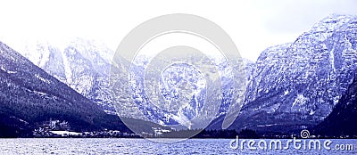 Panorama of Hallstatt lake outdoor with snow mountain background blue tone in Austria, Austrian alps Stock Photo