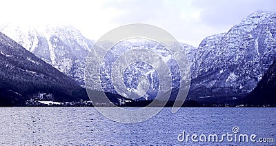 Panorama of Hallstatt lake outdoor with snow mountain background blue tone in Austria in Austrian alps Stock Photo