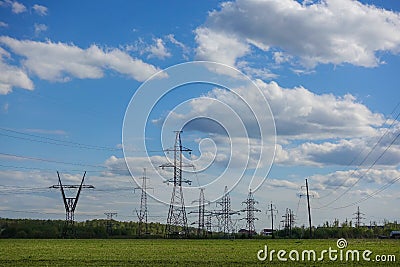 Panorama of high voltage substation. Distribution electrical power. Silhouettes of pylons and towers Stock Photo