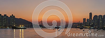 Idyllic landscape of harbor of Hong Kong city under sunset Stock Photo